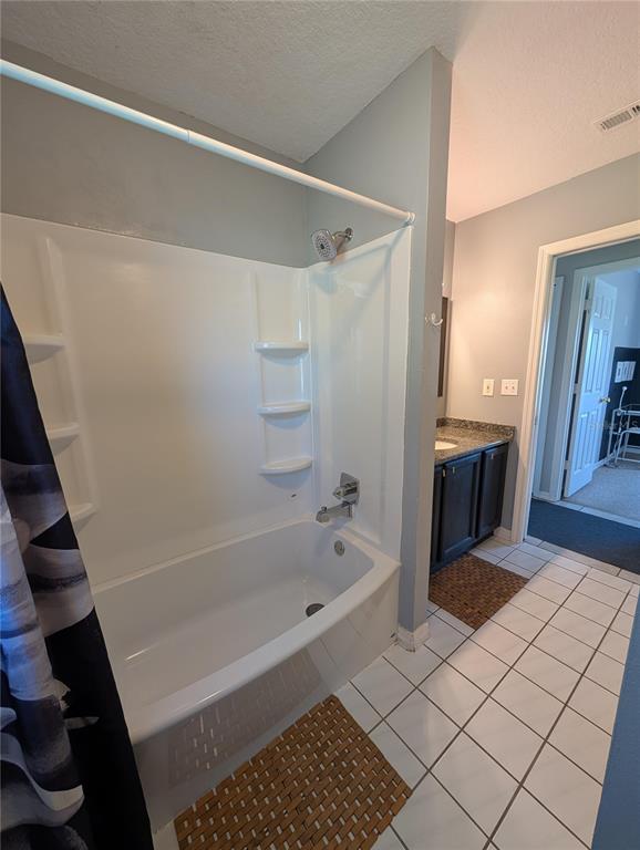 1675 Judith Drive, Unit A Kissimmee, FL 34758 - Photo 3 of 24 a bathroom with a bathtub and a shower