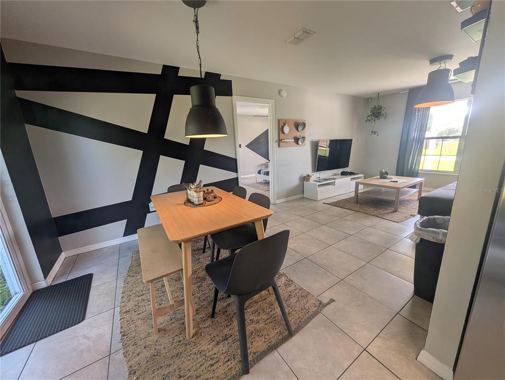 1675 Judith Drive, Unit A Kissimmee, FL 34758 - Photo 6 of 24 a view of a livingroom with furniture and hardwood floor