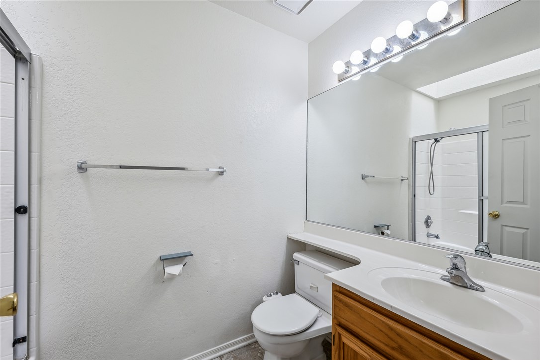 2524 South Ridge Avenue Bullhead City, AZ 86429 - Photo 39 of 64 Bathroom featuring toilet, a shower with shower door, and vanity