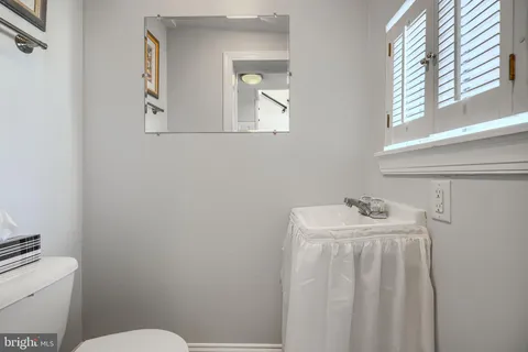 a bathroom with a sink and a window