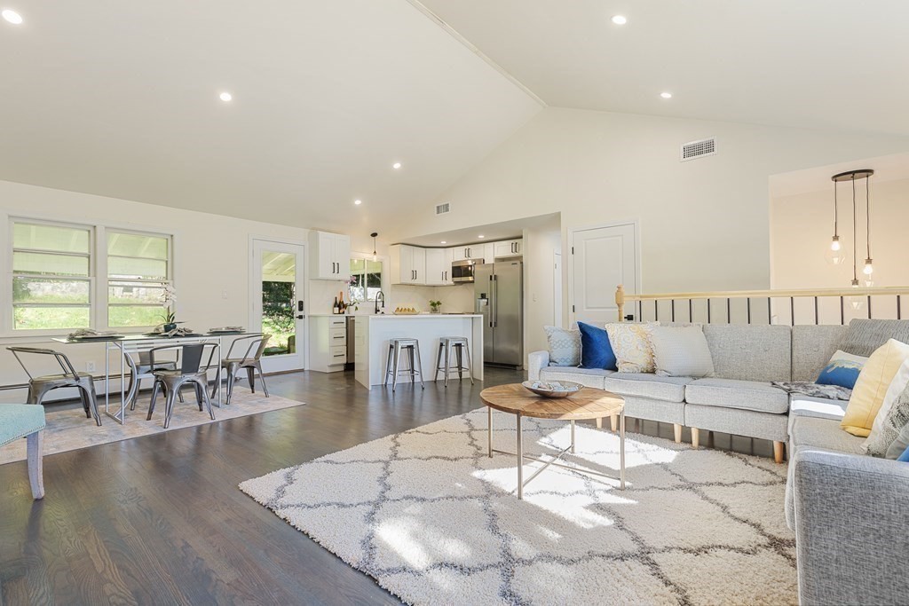 45 Revere Road Woburn, MA 01801 - Photo 11 of 32 a living room with furniture and a table