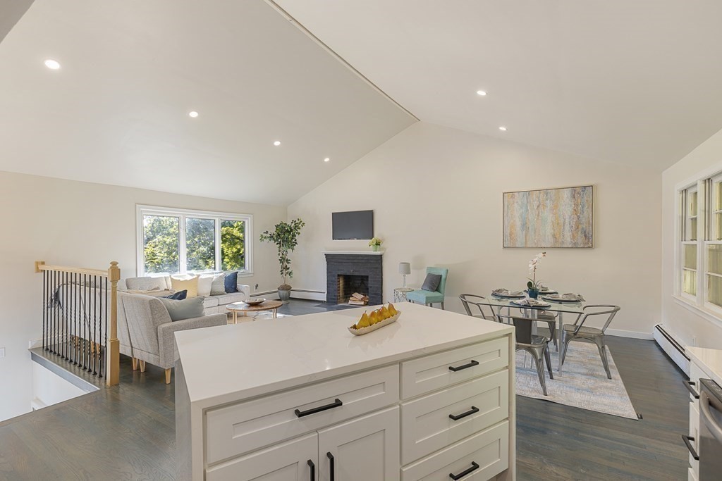 45 Revere Road Woburn, MA 01801 - Photo 14 of 32 a living room with fireplace furniture and a large window