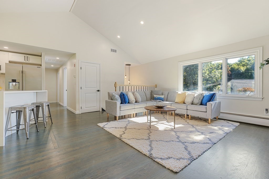 45 Revere Road Woburn, MA 01801 - Photo 16 of 32 a living room with furniture and a large window