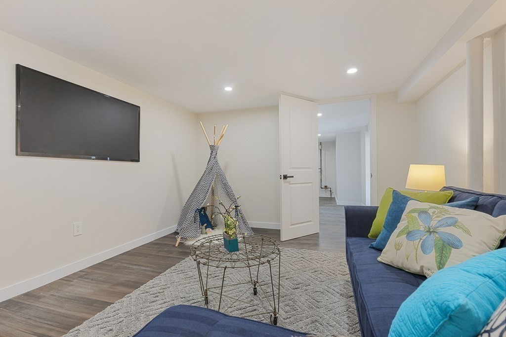 45 Revere Road Woburn, MA 01801 - Photo 21 of 32 a living room with furniture and a wooden floor