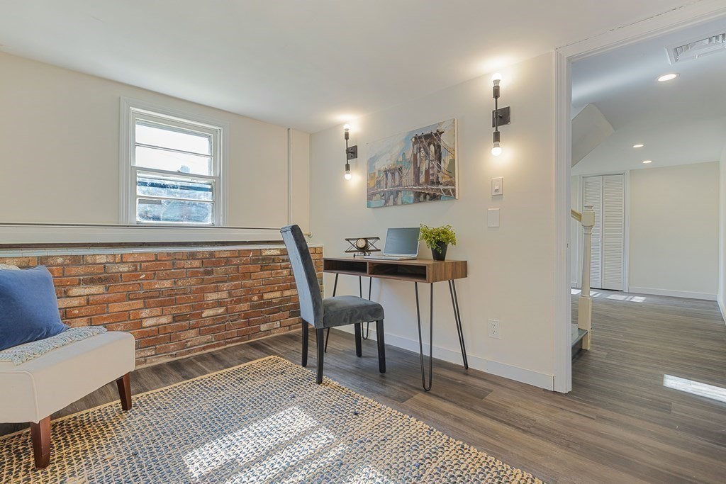 45 Revere Road Woburn, MA 01801 - Photo 22 of 32 a view of a livingroom with furniture and a window