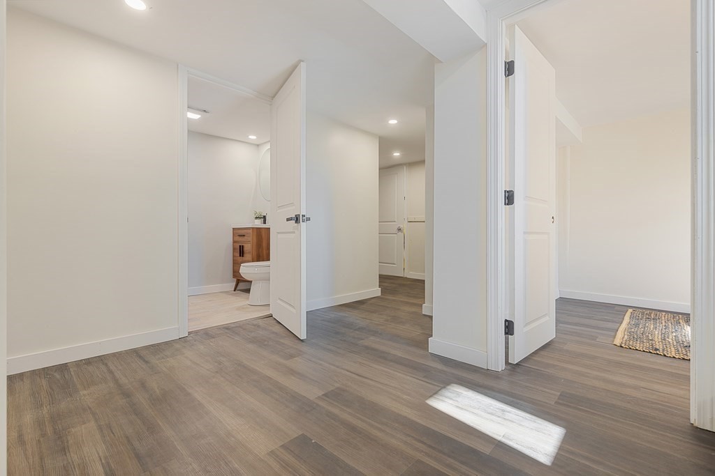 45 Revere Road Woburn, MA 01801 - Photo 26 of 32 a view of an empty room and wooden floor