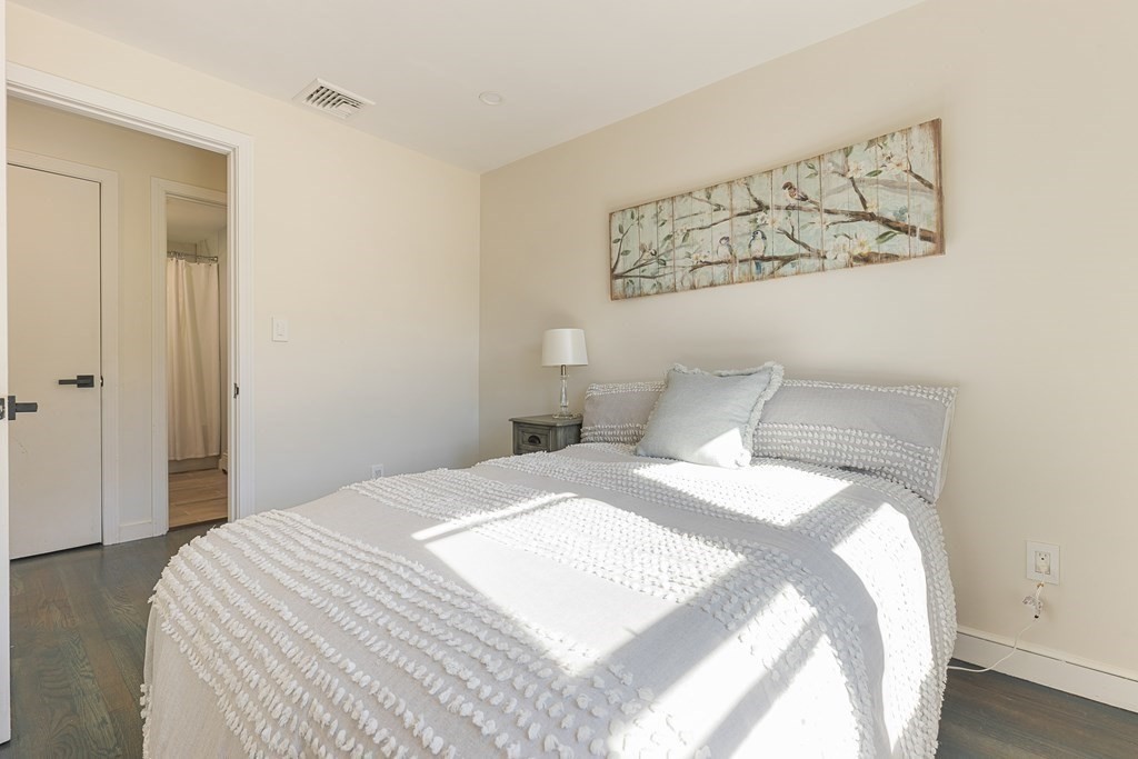 45 Revere Road Woburn, MA 01801 - Photo 3 of 32 a bedroom with a bed and a window