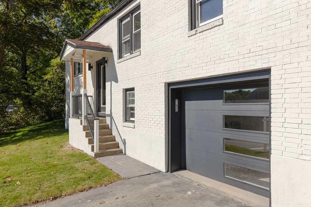 45 Revere Road Woburn, MA 01801 - Photo 31 of 32 a front view of a house with a yard