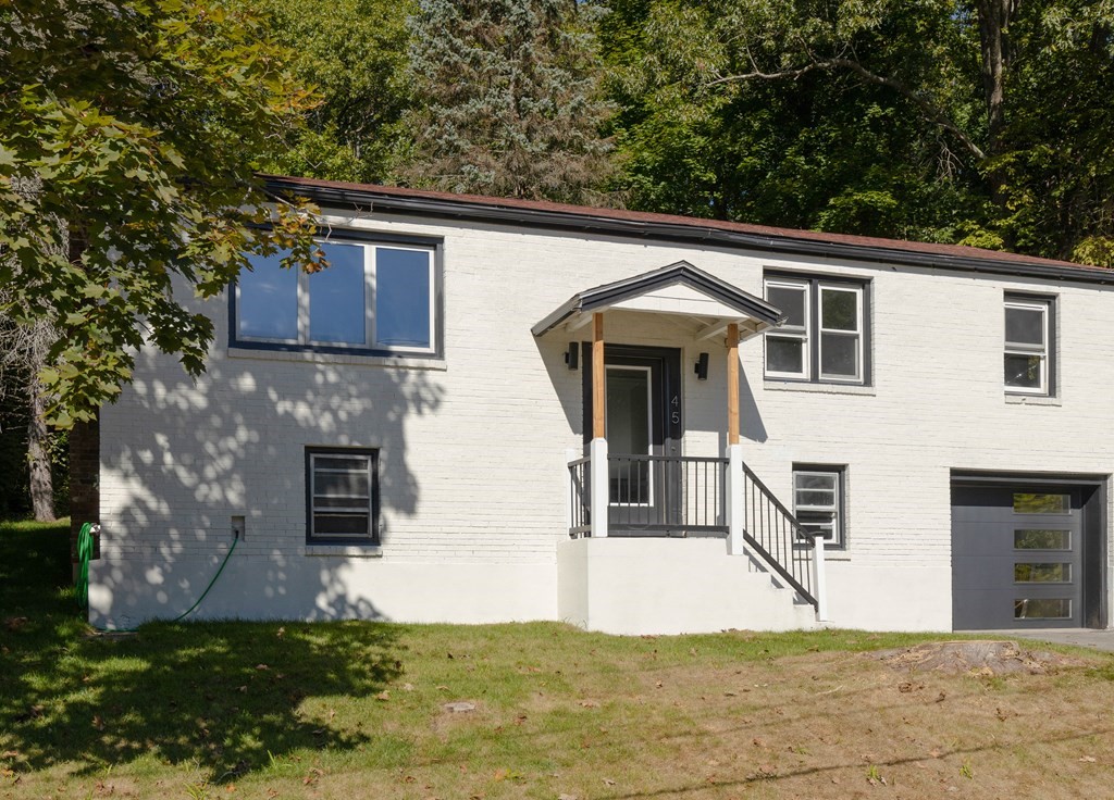 45 Revere Road Woburn, MA 01801 - Photo 32 of 32 a front view of a house with a yard