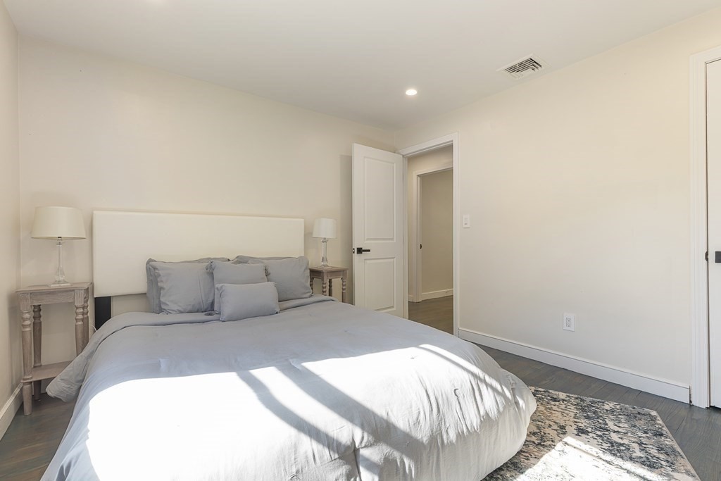 45 Revere Road Woburn, MA 01801 - Photo 5 of 32 a bedroom with a bed and a window