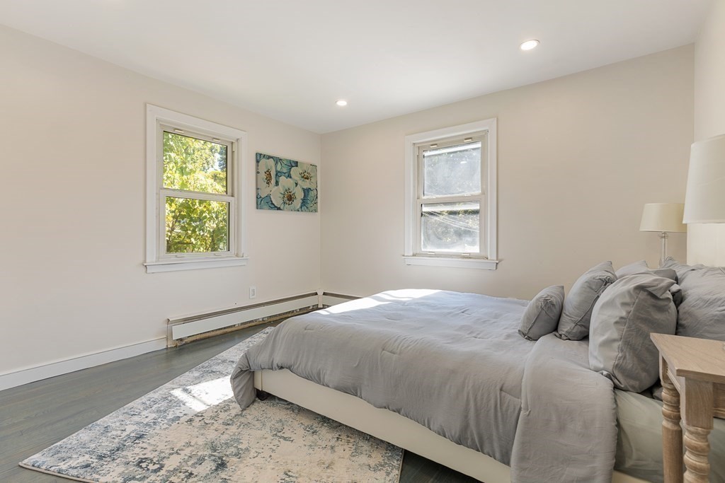 45 Revere Road Woburn, MA 01801 - Photo 6 of 32 a bedroom with a bed and a window