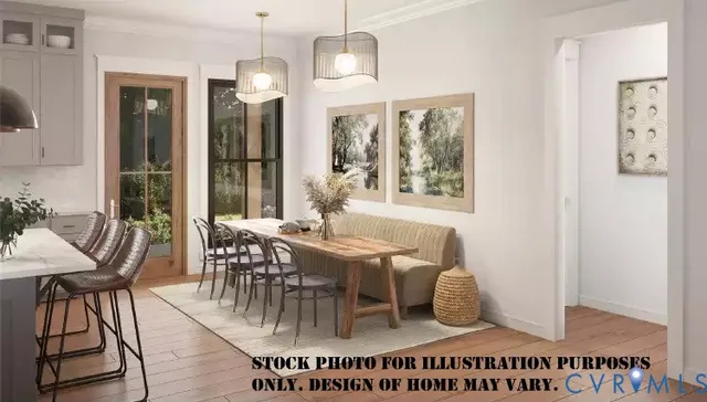 a view of a dining room with furniture and a chandelier
