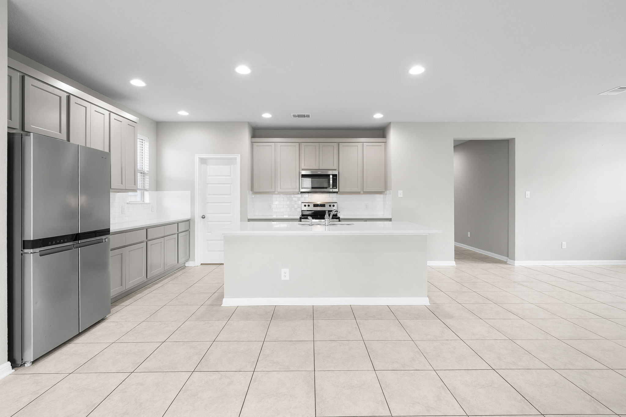 313 Mclintock Road Jarrell, TX 76537 - Photo 15 of 40 Culinary creations come to life in this kitchen, featuring an inviting island and contemporary appliances.