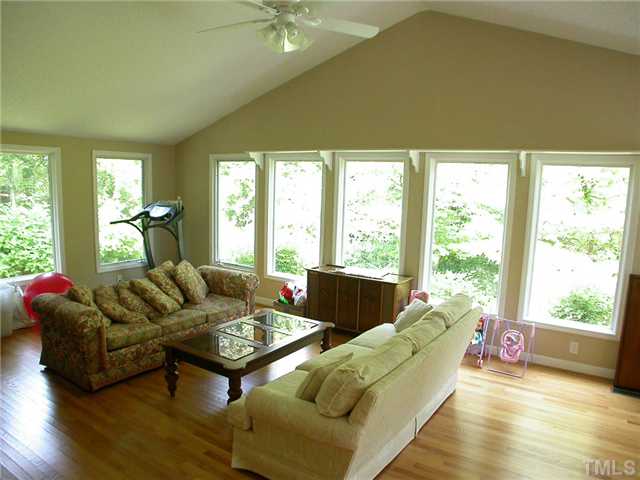 11708 Trottenham Street Raleigh, NC 27614 - Photo 10 of 22 Large dun room on the rear of the home overlooking the back yard. Cath. ceiling, ceiling fan, and hardwood floors.