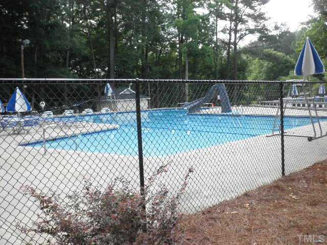 11708 Trottenham Street Raleigh, NC 27614 - Photo 20 of 22 View of the community pool with kids area, water slide, and some of the chairs and tables. Many activities for adults and children. Community has a TSA swim team.