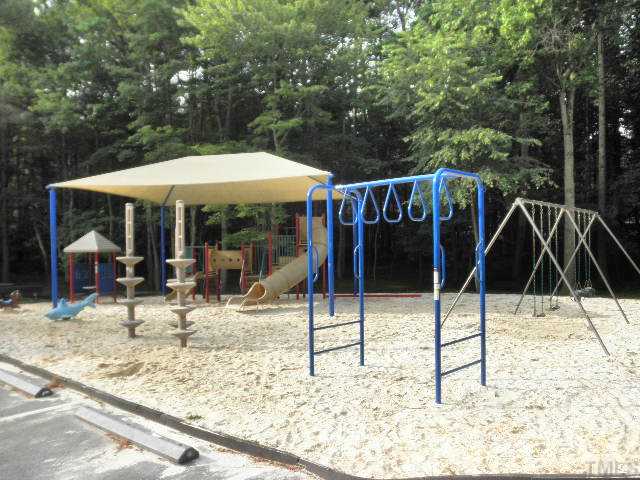 11708 Trottenham Street Raleigh, NC 27614 - Photo 21 of 22 Large play ground for children including slides, climbing bars, kids riding figures, and swings. Located at pool across the parking lot.
