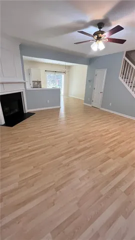 a kitchen with granite countertop a sink a stove and cabinets