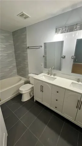 a view of empty room with ceiling fan