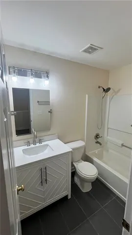 a bathroom with a sink and vanity