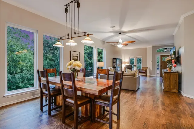 a view of a dining room with furniture window and wooden floor