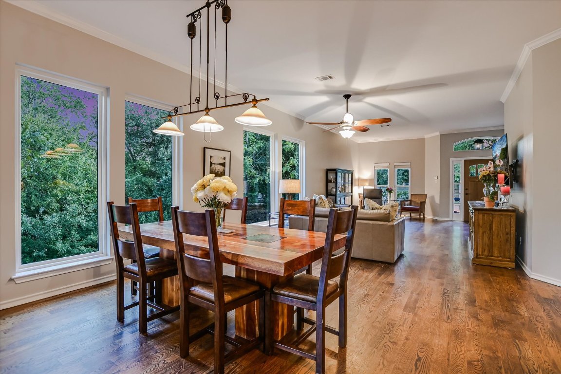 5507 Mt Bonnell Road Austin, TX 78731 - Photo 11 of 35 a view of a dining room with furniture window and wooden floor