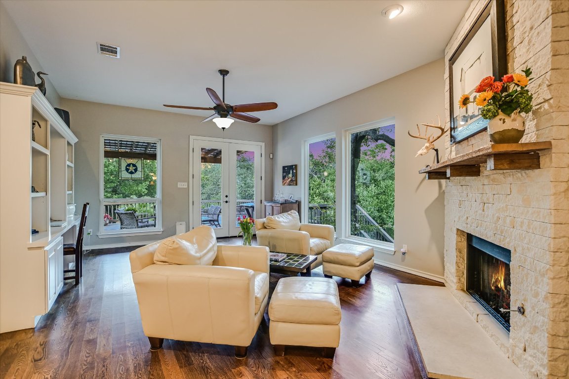 5507 Mt Bonnell Road Austin, TX 78731 - Photo 13 of 35 a living room with furniture fireplace and large windows