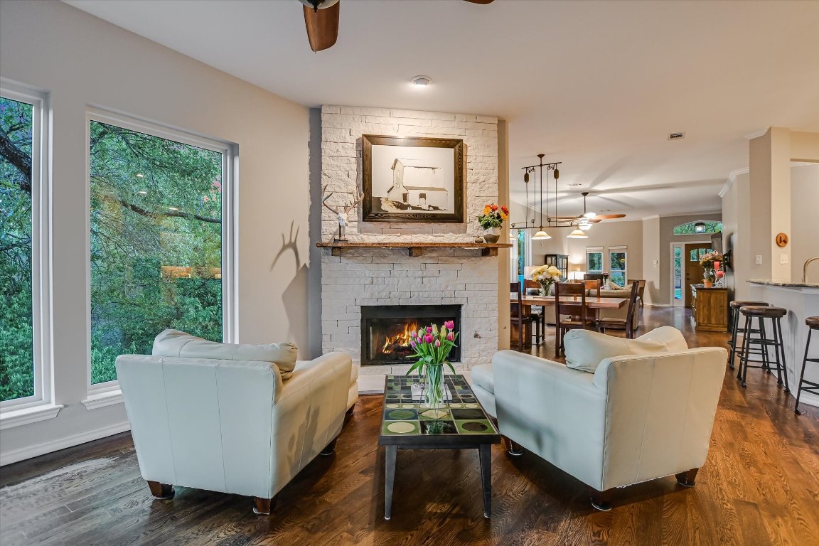 5507 Mt Bonnell Road Austin, TX 78731 - Photo 14 of 35 a living room with furniture a fireplace and a large window