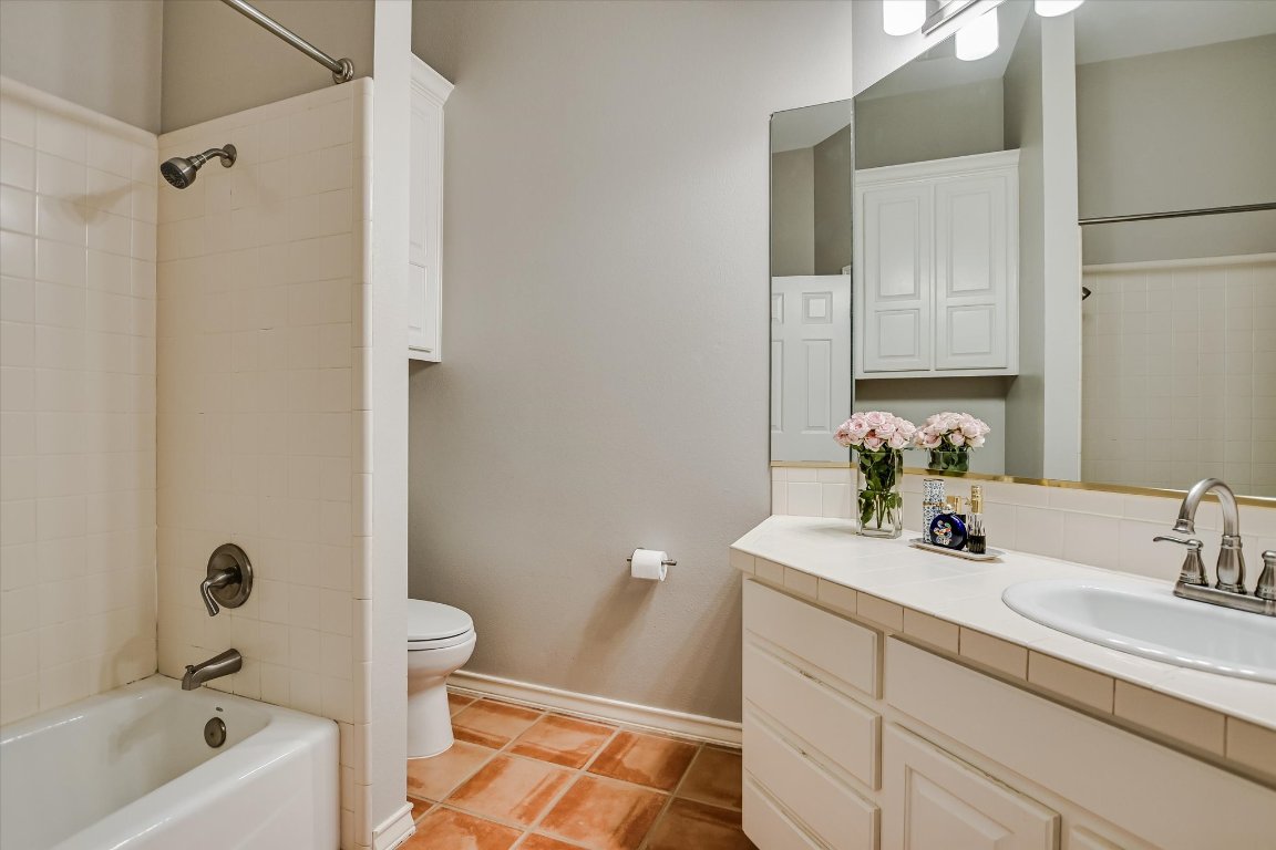 5507 Mt Bonnell Road Austin, TX 78731 - Photo 25 of 35 a bathroom with a sink a toilet and shower