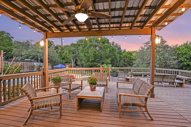 a view of a chairs and tables on the roof deck