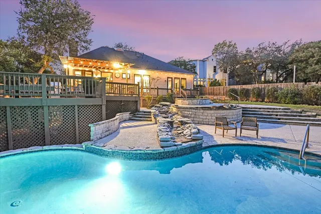 a view of a swimming pool with a patio
