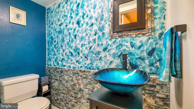 a bathroom with a toilet and a sink