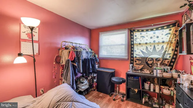 a view of a room with workspace and music instruments
