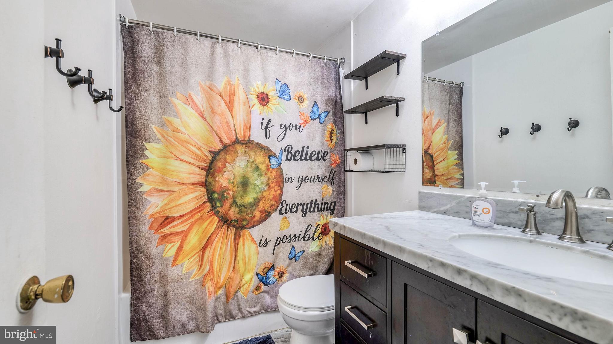9 Ridgewood Place Willingboro, NJ 08046 - Photo 17 of 19 a bathroom with a granite countertop sink a toilet and a mirror