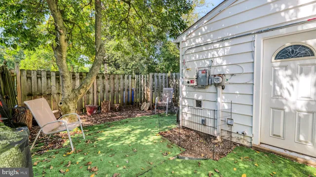 a view of outdoor space with seating area and green space