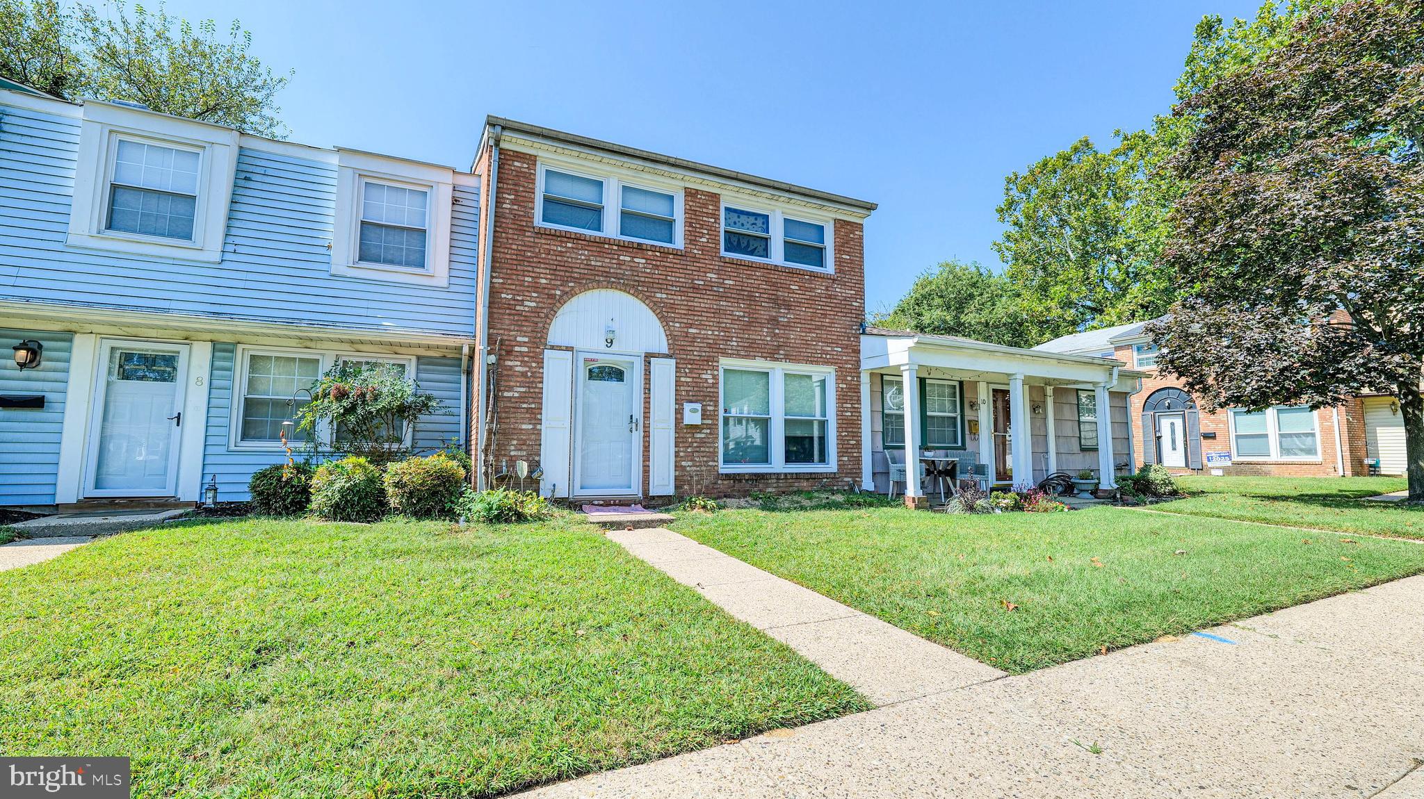 9 Ridgewood Place Willingboro, NJ 08046 - Photo 2 of 19 a view of a brick house with a yard and plants