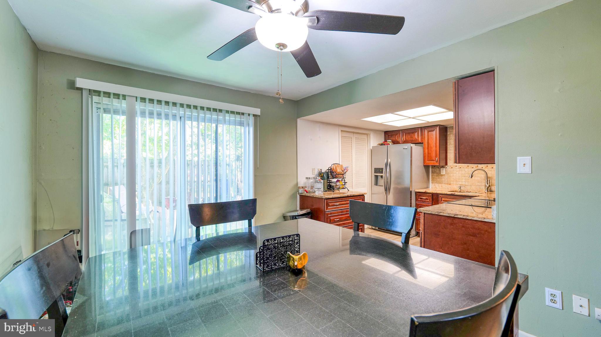 9 Ridgewood Place Willingboro, NJ 08046 - Photo 8 of 19 a living room with furniture and a chandelier