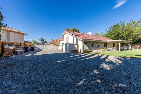 1217 Flora Way Ridgecrest, CA 93555 - Photo 37 of 39 a view of a house with a yard