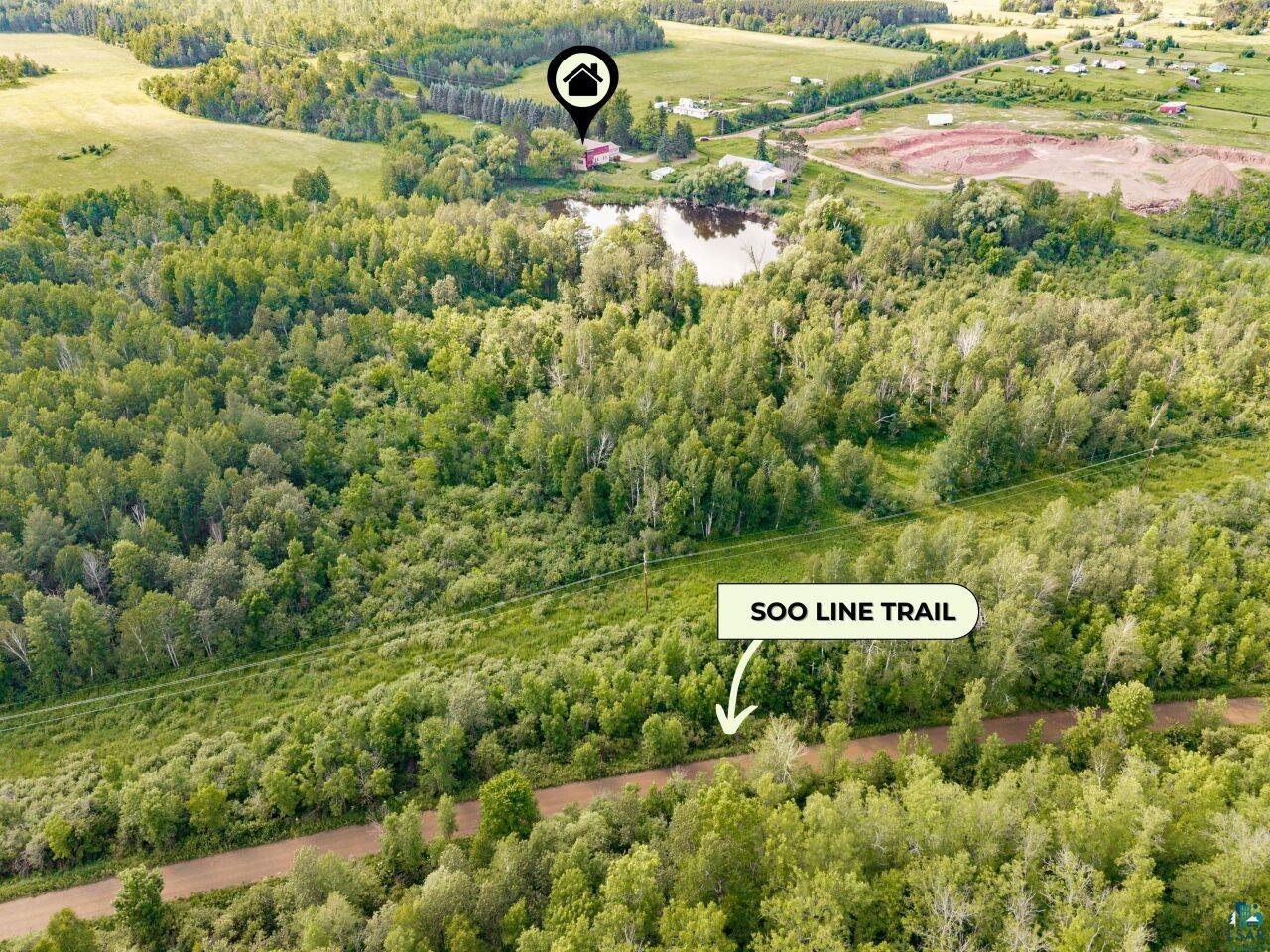 4800 Tower Road Moose Lake, MN 55767 - Photo 6 of 83 Aerial overview showcasing extensive wooded acreage, a private pond, and a nearby trail