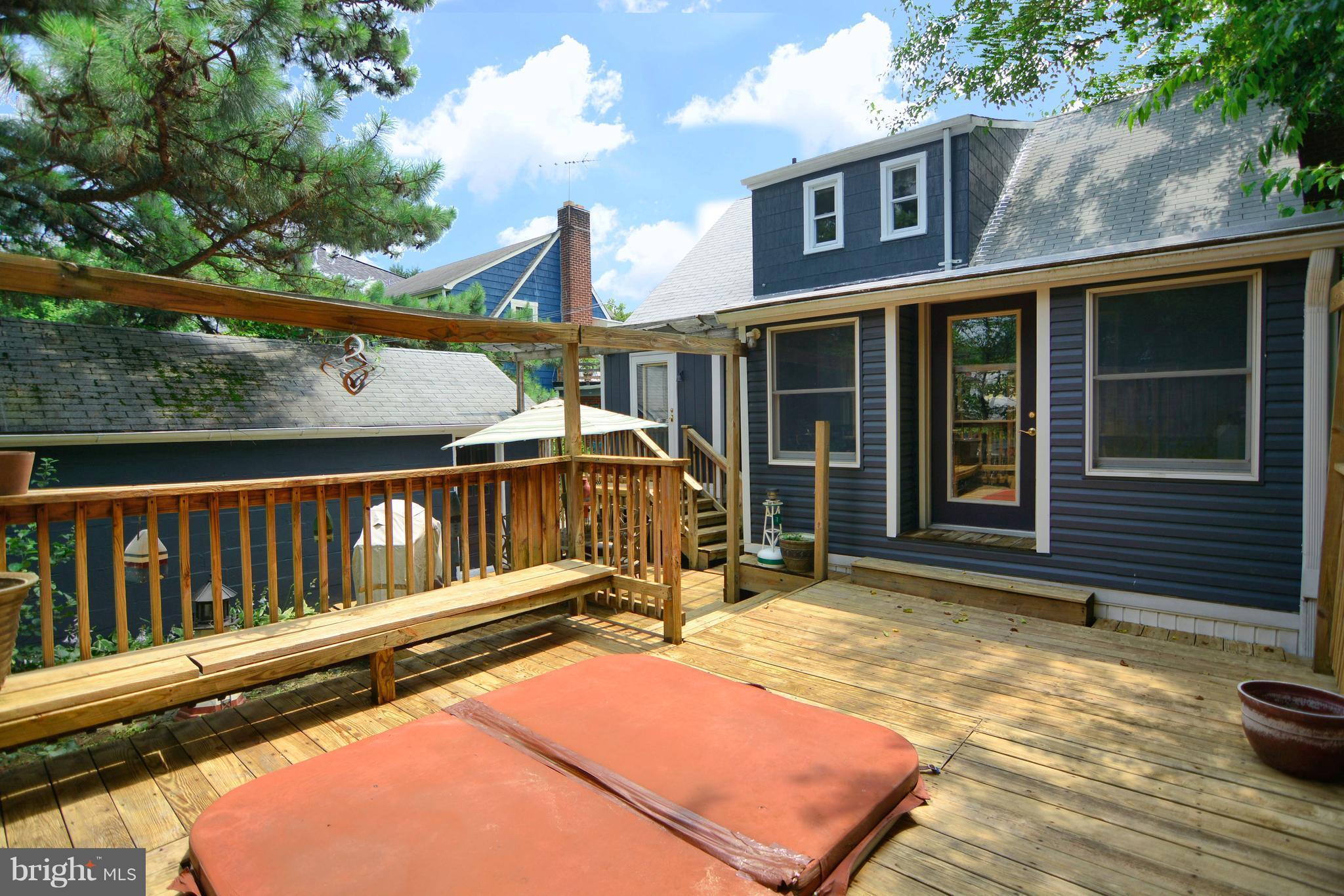614 Dunkirk Road Baltimore, MD 21212 - Photo 18 of 30 Tiered Deck with Hot Tub, Bench, and privacy fence