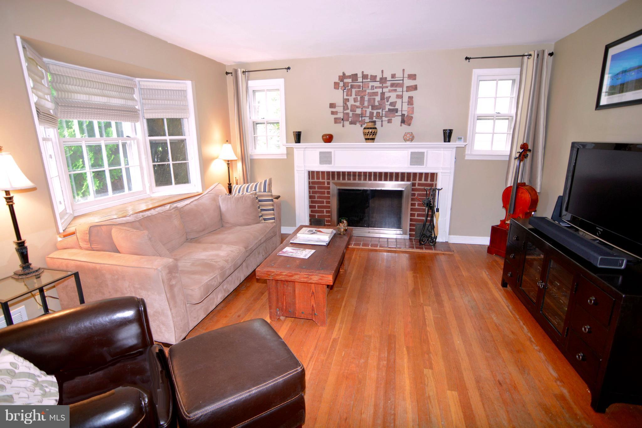 614 Dunkirk Road Baltimore, MD 21212 - Photo 26 of 30 enhanced with wood burning FP & wood floors