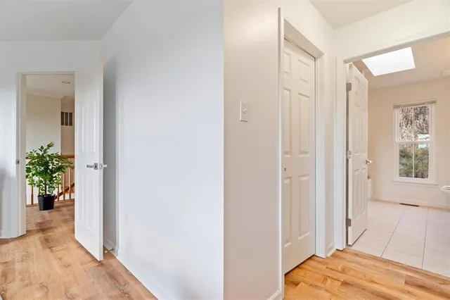 a view of walk in closet with clothes