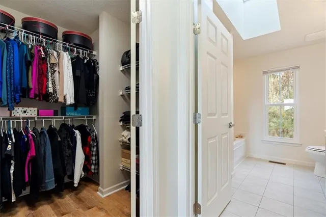 a bathroom with a bathtub and shower