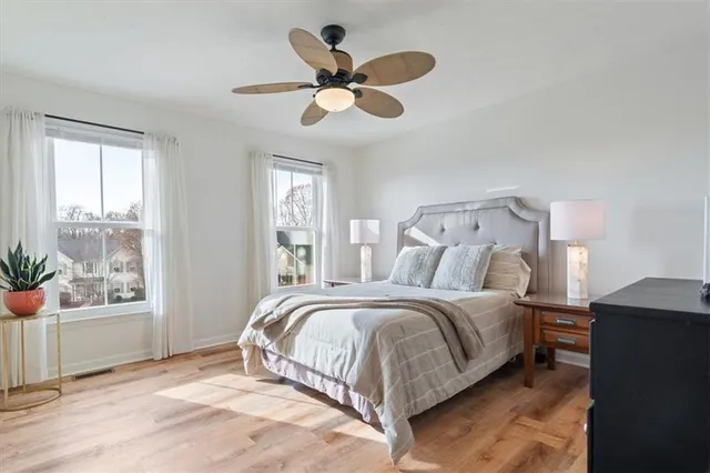 a bedroom with a bed and a window