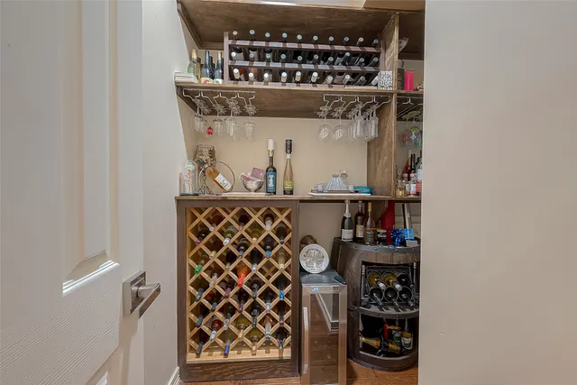 a view of a hallway with wooden floor and closet