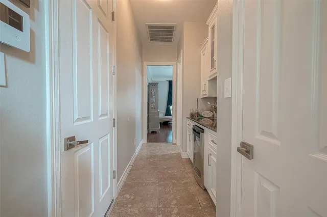 a kitchen with appliances cabinets and a counter top space