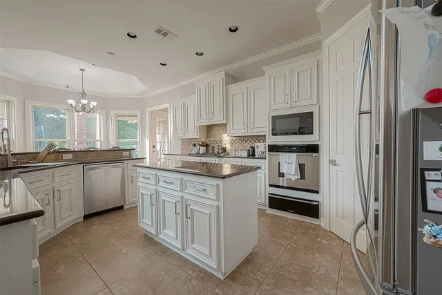 a large kitchen with cabinets