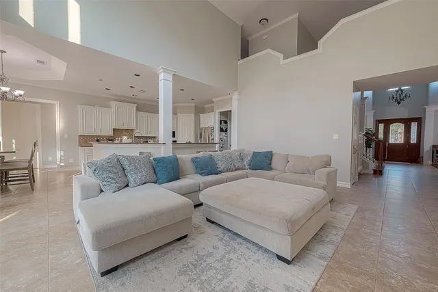 a living room with fireplace furniture and a flat screen tv