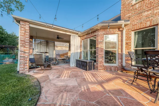 a view of a park with slide and a bench