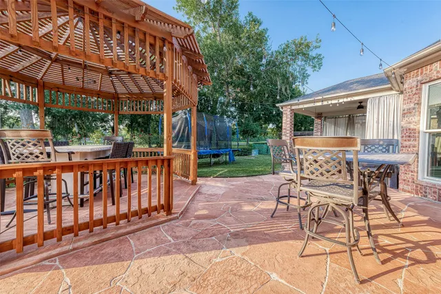 a outdoor dining space with furniture and outdoor view