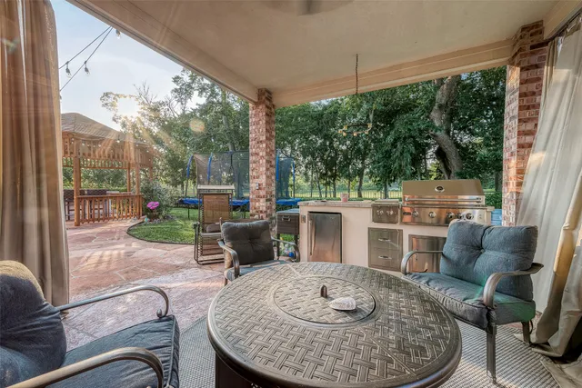 a view of a backyard with sitting area